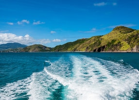 view of st kitts and nevis from catamaran in ocean