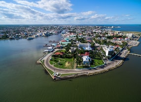 belize cityscape with lighthouse and caribbean sea