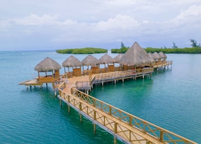 overwater bungalow experience close from behind